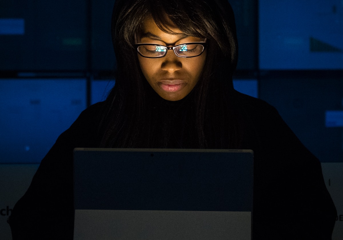 A woman working at a laptop during a mentoring session